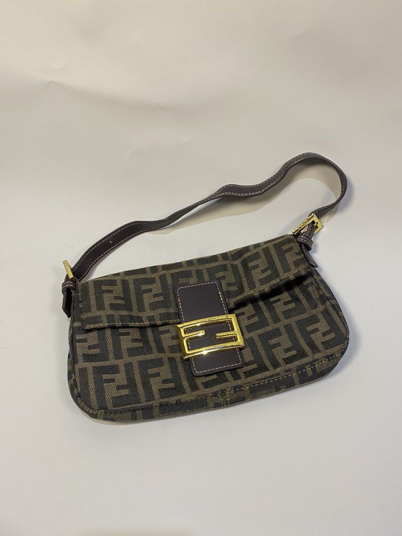 Fendi Zucca Baguette Bag (Category: Luxury Bags & Wallets) located in General Santos City (Dadiangas). Submitted by jokk.x (Listing ID 1461323809, Image 1). Description: - Authentic Fendi Zucca canvas baguette bag - Classic brown and black monogram print - Gold-tone FF hardware detail - Genuine leather strap and trim - Made in Italy - Authenticity guaranteed.