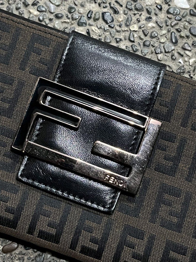 FENDI ZUCCA CONTINENTAL FLAP LONG WALLET (Category: Luxury Bags & Wallets) located in San Fernando. Submitted by archivalhighlights (Listing ID 1461293440, Image 3). Description: FENDI ZUCCA CONTINENTAL FLAP LONG WALLET CONDITION-10/10 MATERIAL- FF CANVAS HARDWEAR- SILVER-TONE METAL BUCKLE MADE IN- ITALY.