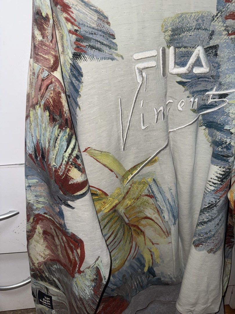FILA Van Gogh Museum Sweatshirt (Category: Coats, Jackets and Outerwear) located in Manila. Submitted by quintessesommerset (Listing ID 1461226889, Image 2). Description: - Authentic FILA sweatshirt with a unique Van Gogh Museum print. 24x29 - Features embroidered FILA logo and 'Vincent' text. - All-over artistic design, perfect for art and streetwear enthusiasts. - Size: XL - A true statement piece for your wardrobe..