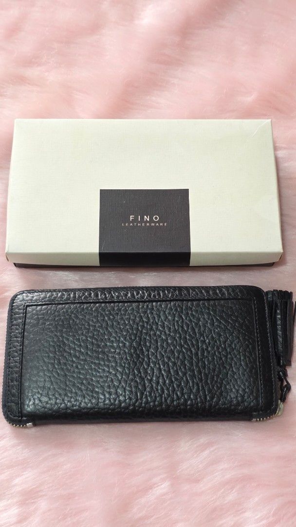 Fino Black Textured Zip Around Wallet (Category: Wallets & Card holders) located in Manila. Submitted by mpirerules (Listing ID 1461138783, Image 1). Description: - FINO LEATHERWARE black textured leather wallet - Zip around closure with tassel pull - Multiple interior card slots and compartments - Comes with original box - Ideal for organizing your essentials.