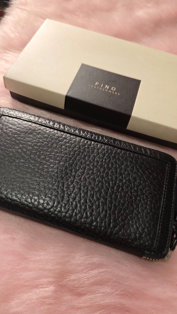 Fino Black Textured Zip Around Wallet (Category: Wallets & Card holders) located in Manila. Submitted by mpirerules (Listing ID 1461138783, Image 3). Description: - FINO LEATHERWARE black textured leather wallet - Zip around closure with tassel pull - Multiple interior card slots and compartments - Comes with original box - Ideal for organizing your essentials.