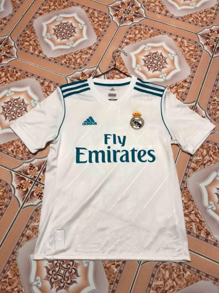 Football Jerseys (Category: Activewear) located in Malabon City. Submitted by matcha_frappe (Listing ID 1461267341, Image 1). Description: - Authentic Adidas football jerseys - White Real Madrid jersey with 'Fly Emirates' sponsor - Red and yellow Spain jersey with 'SPAIN 7' on the back - Ideal for any football enthusiast - Great value for both jerseys.