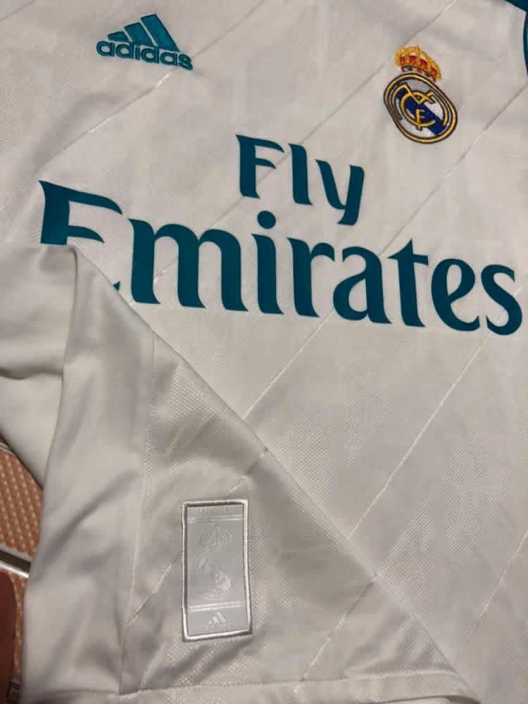 Football Jerseys (Category: Activewear) located in Malabon City. Submitted by matcha_frappe (Listing ID 1461267341, Image 3). Description: - Authentic Adidas football jerseys - White Real Madrid jersey with 'Fly Emirates' sponsor - Red and yellow Spain jersey with 'SPAIN 7' on the back - Ideal for any football enthusiast - Great value for both jerseys.
