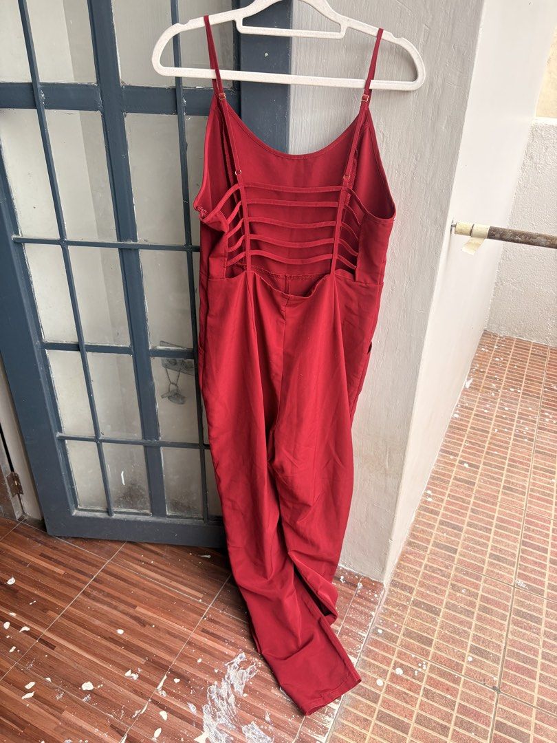 Forever 21 Red Strappy Back Jumpsuit (Category: Jumpsuits) located in Cainta. Submitted by declutteringprelovedbyzelle (Listing ID 1461248157, Image 2). Description: - Brand: Forever 21 - Color: Red - Style: Spaghetti strap jumpsuit - Features: Unique strappy back detail, wide leg pants, pockets - Occasion: Night out, casual day - Benefits: Comfortable, stylish.