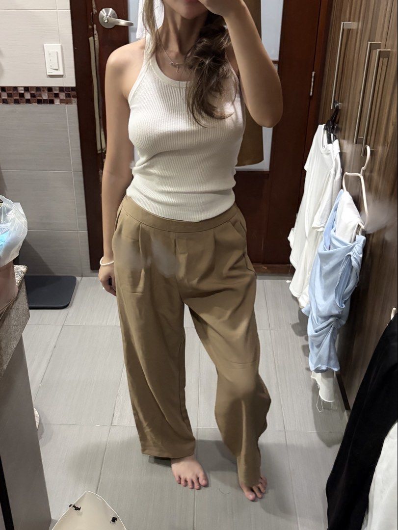 ForMe Wide Leg Cropped Trousers (Category: Other Bottoms) located in Pasig City. Submitted by luxurypreloved12 (Listing ID 1461256318, Image 2). Description: - Wide leg cropped pants - Relaxed fit, stretchy - Neutral tan color - Side pockets - Easy to pair with any top - LALAMOVE / LBC from Pasig - Decluttering - Flaws : stitching is coming loose in one of the legs No LP lowballers or joy reservers here! lets not waste each others time :).