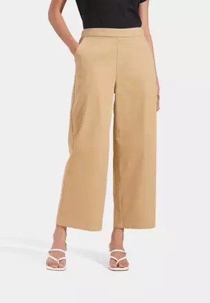 ForMe Wide Leg Cropped Trousers (Category: Other Bottoms) located in Pasig City. Submitted by luxurypreloved12 (Listing ID 1461256318, Image 1). Description: - Wide leg cropped pants - Relaxed fit, stretchy - Neutral tan color - Side pockets - Easy to pair with any top - LALAMOVE / LBC from Pasig - Decluttering - Flaws : stitching is coming loose in one of the legs No LP lowballers or joy reservers here! lets not waste each others time :).