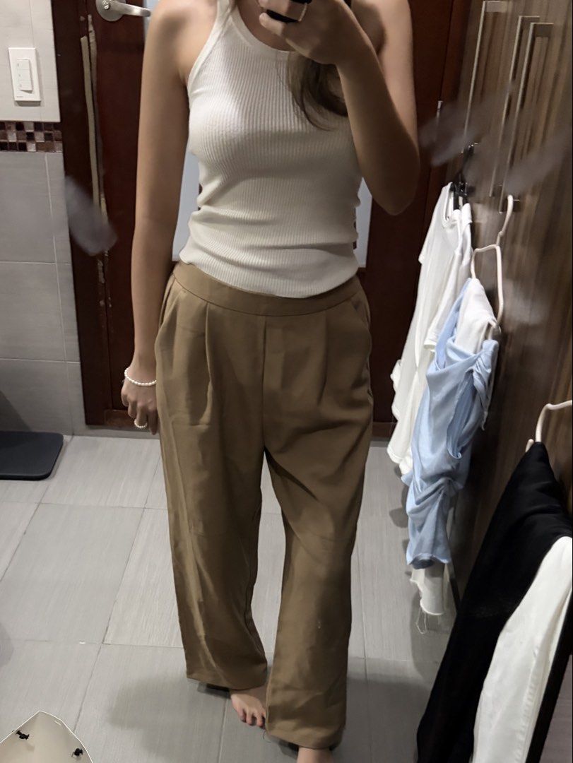 ForMe Wide Leg Cropped Trousers (Category: Other Bottoms) located in Pasig City. Submitted by luxurypreloved12 (Listing ID 1461256318, Image 3). Description: - Wide leg cropped pants - Relaxed fit, stretchy - Neutral tan color - Side pockets - Easy to pair with any top - LALAMOVE / LBC from Pasig - Decluttering - Flaws : stitching is coming loose in one of the legs No LP lowballers or joy reservers here! lets not waste each others time :).