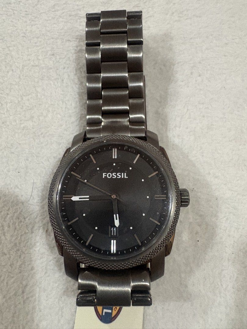 Fossil Machine Chronograph Watch FS4774 (Category: Men's Watches) located in Manila. Submitted by dig76 (Listing ID 1461203628, Image 2). Description: - Fossil Machine Watch - Gunmetal stainless steel band and case - Black dial with date window - Includes original box and tag - Model: FS4774 - Japan movement.