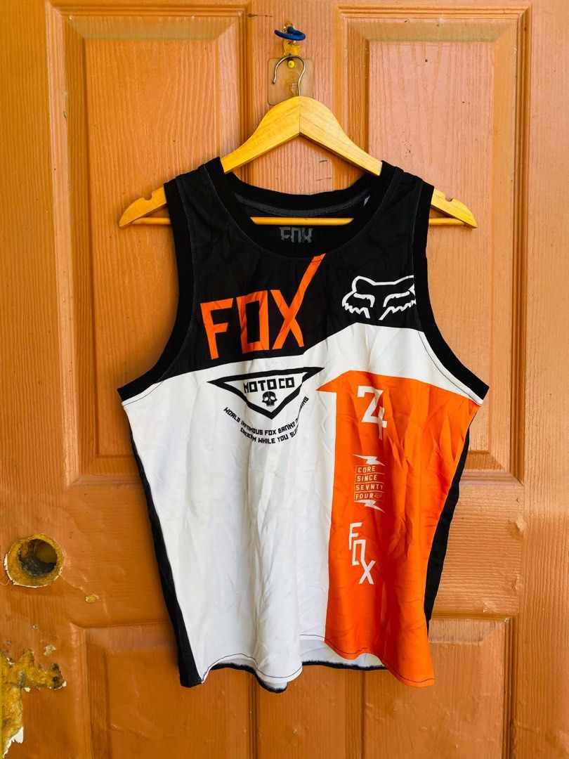 Fox Racing Motocross Jersey Tank Top (Category: Activewear) located in Digos. Submitted by thrifthed.ph (Listing ID 1461320187, Image 2). Description: - Brand: Fox Racing - Style: Sleeveless motocross jersey / tank top -med T L -like new -dimes:20.5.28 -no issue -authentic -complete tags -need wash -suitable for picky buyer -solid condi -solid colorate -cl:10/10 -no issue -no return no exchange - Colors: Black, white, and orange - Features: Iconi