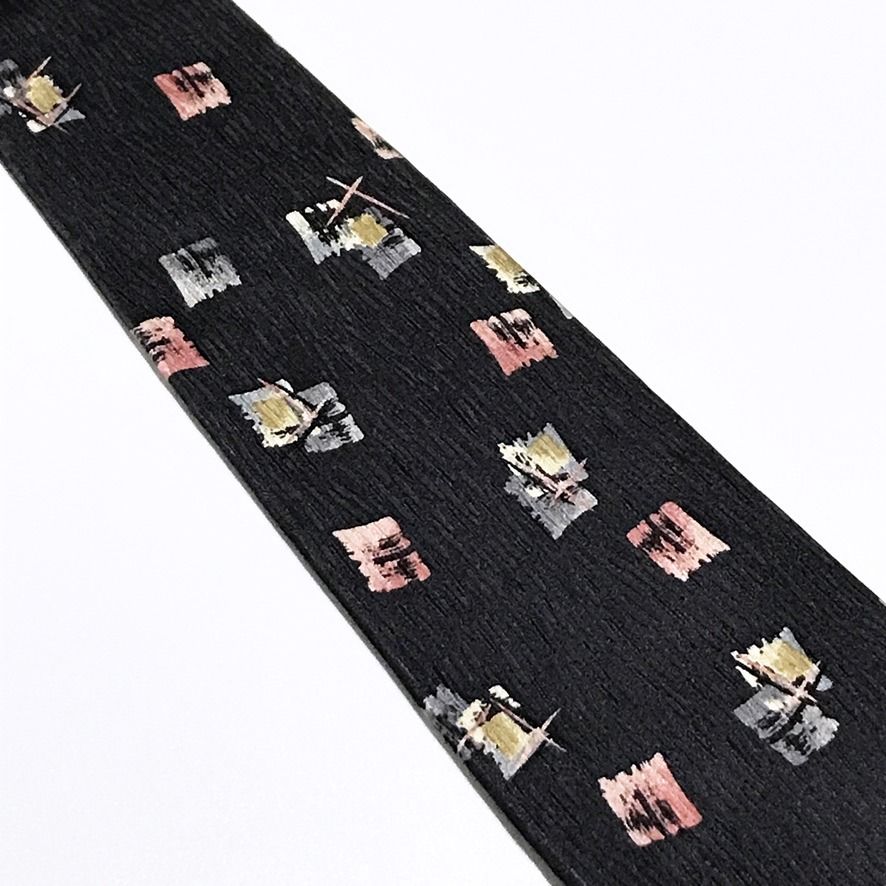 Franco Valentino Abstract Pattern Black Neck Tie (Category: Ties) located in Taguig. Submitted by retrogaze (Listing ID 1461252586, Image 3). Description: Franco Valentino is an Italian-inspired neckwear brand known for crafting vintage-era silk ties that combine distinctive textural weaves with artistic, painterly abstract patterns and refined European tailoring. This 100% silk necktie by Franco Valentino features a solid black base with a uniqu