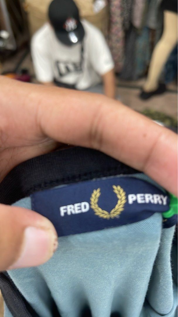FRED PERRY TAPED ARM TAPED LOGO (Category: Tshirts & Polo Shirts ) located in Manila. Submitted by 5kcollectiveph (Listing ID 1461239186, Image 3). Description: FRED PERRY TAPED ARM LOGO -Large -Width: 22 -Length: 28 -Like new / Excellent condi.