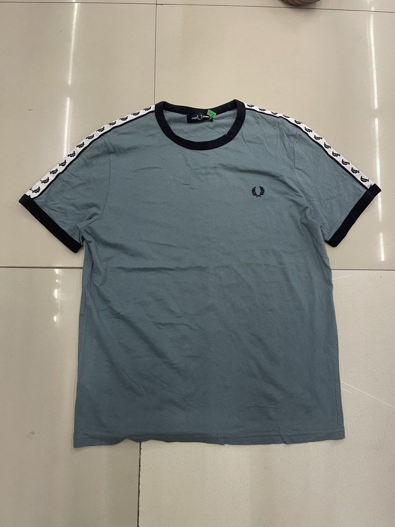 FRED PERRY TAPED ARM TAPED LOGO (Category: Tshirts & Polo Shirts ) located in Manila. Submitted by 5kcollectiveph (Listing ID 1461239186, Image 1). Description: FRED PERRY TAPED ARM LOGO -Large -Width: 22 -Length: 28 -Like new / Excellent condi.