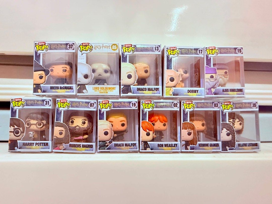 Harry Potter Bitty Pop Set (Category: Designer & Blind Box Toys) located in Mandaluyong City. Submitted by mrs.c_04 (Listing ID 1461227202, Image 1). Description: - Complete your Harry Potter Bitty Pop! - Includes 10 iconic characters: Minerva McGonagall, Lord Voldemort, Draco Malfoy, Dobby, Albus Dumbledore, Harry Potter, Rubeus Hagrid, Ron Weasley, Hermione Granger, and Bellatrix Lestrange. - All figures are in their original, unopened boxes. -