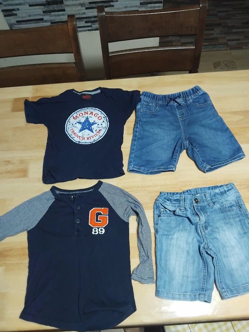 Gap & Baby Gap Kids Clothes Bundle - Size 3T (Category: Babies & Kids Fashion) located in Manila. Submitted by ghisky_24 (Listing ID 1461116679, Image 1). Description: - Bundle of 5 kids' clothing items, all size 3T. - Two pairs of denim shorts. - One navy blue long-sleeve shirt with orange 'G' graphic. - One navy blue short-sleeve shirt with 'Monaco' graphic. - One blue Gap t-shirt with bear graphic. - One pair of tan shorts. For 3 to 5 years ol