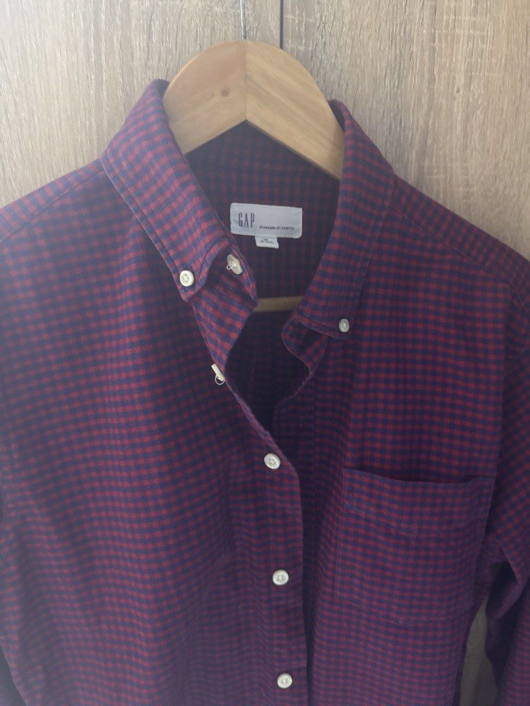 GAP Men's Red and Navy Gingham Button-Down Shirt (Category: Tshirts & Polo Shirts ) located in Mandaluyong City. Submitted by raykin (Listing ID 1461191415, Image 3). Description: - Classic red and navy gingham pattern - Brand: GAP - Style: Button-down collar - Features: Single chest pocket, long sleeves - Versatile: Ideal for casual or smart-casual outfits - Easy Pairing: Looks great with jeans or chinos.