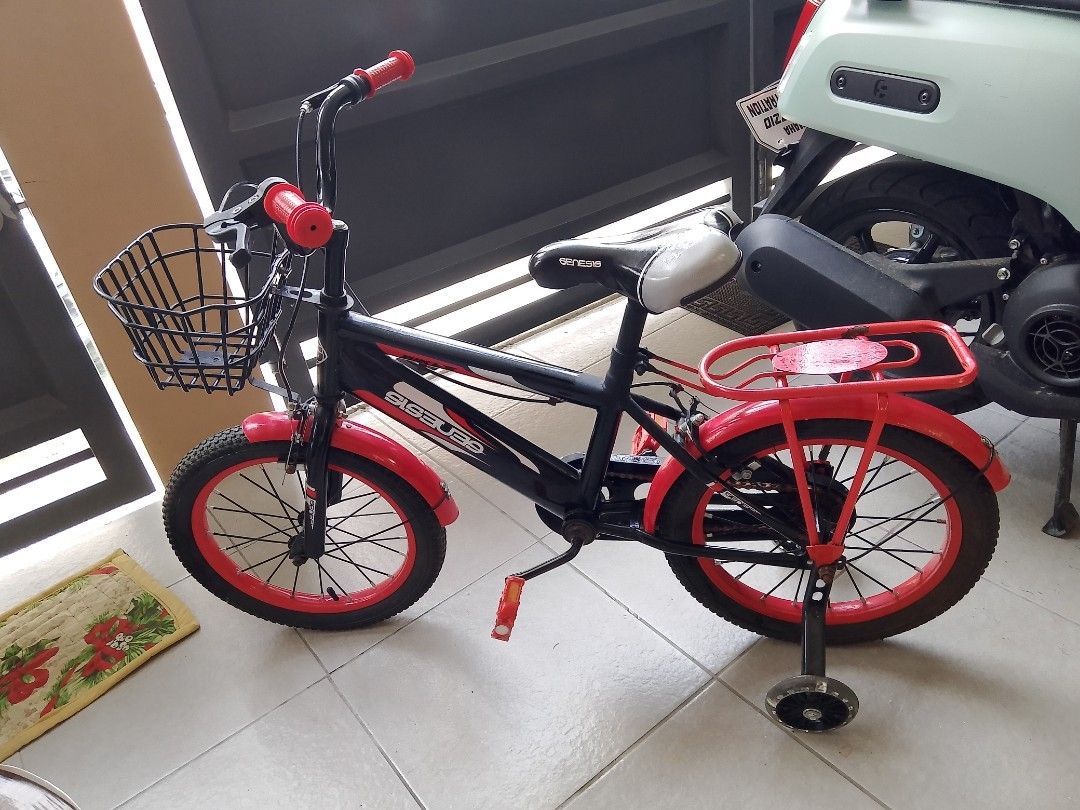 Genesis Kids Bicycle with Training Wheels and Basket (Category: Bicycles) located in Manila. Submitted by yourdailyfindsss (Listing ID 1461195034, Image 2). Description: -Bought at SM San Mateo Department store kids section for over P5,000 Black and red Genesis bicycle for kids - Features a front basket for carrying essentials - Includes a rear rack for extra storage - Comes with training wheels for stability - Ideal for children learning to ride