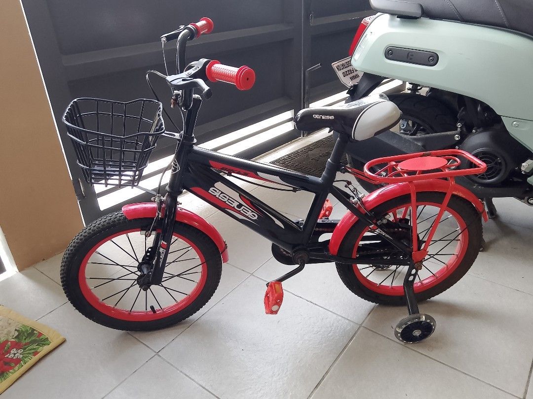 Genesis Kids Bicycle with Training Wheels and Basket (Category: Bicycles) located in Manila. Submitted by yourdailyfindsss (Listing ID 1461195034, Image 1). Description: -Bought at SM San Mateo Department store kids section for over P5,000 Black and red Genesis bicycle for kids - Features a front basket for carrying essentials - Includes a rear rack for extra storage - Comes with training wheels for stability - Ideal for children learning to ride