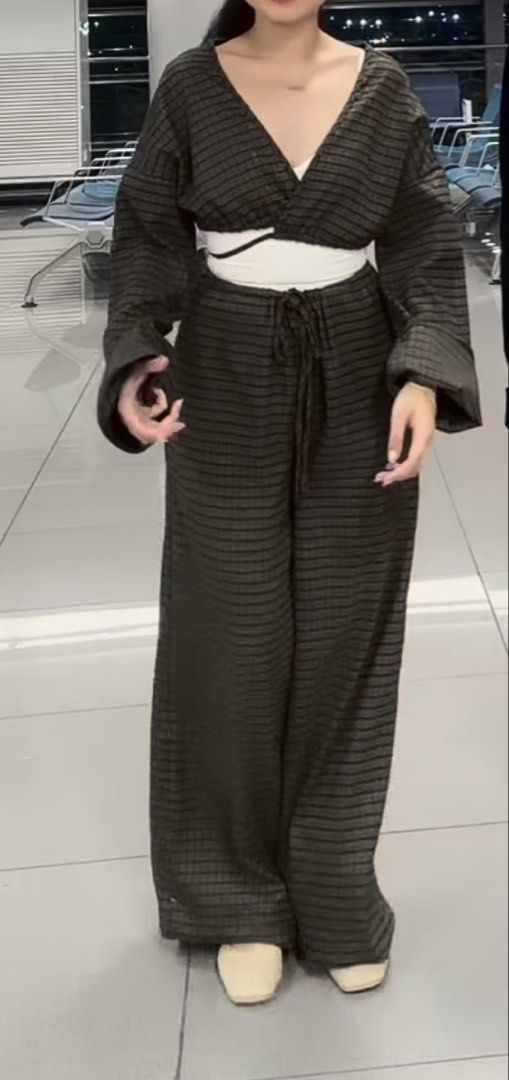 Gingnam brown kimono type blazer and pants (Category: Sets or Coordinates) located in Manila. Submitted by mongosoleigh (Listing ID 1461265444, Image 1). Description: - Black bomber jacket with a stylish white collar. - Features text detail on the front. - Includes matching dark striped wide-leg pants. - Pants have an elastic waistband with a drawstring for comfort. - Ideal for a casual and fashionable look. - Great for travel or everyday wear..
