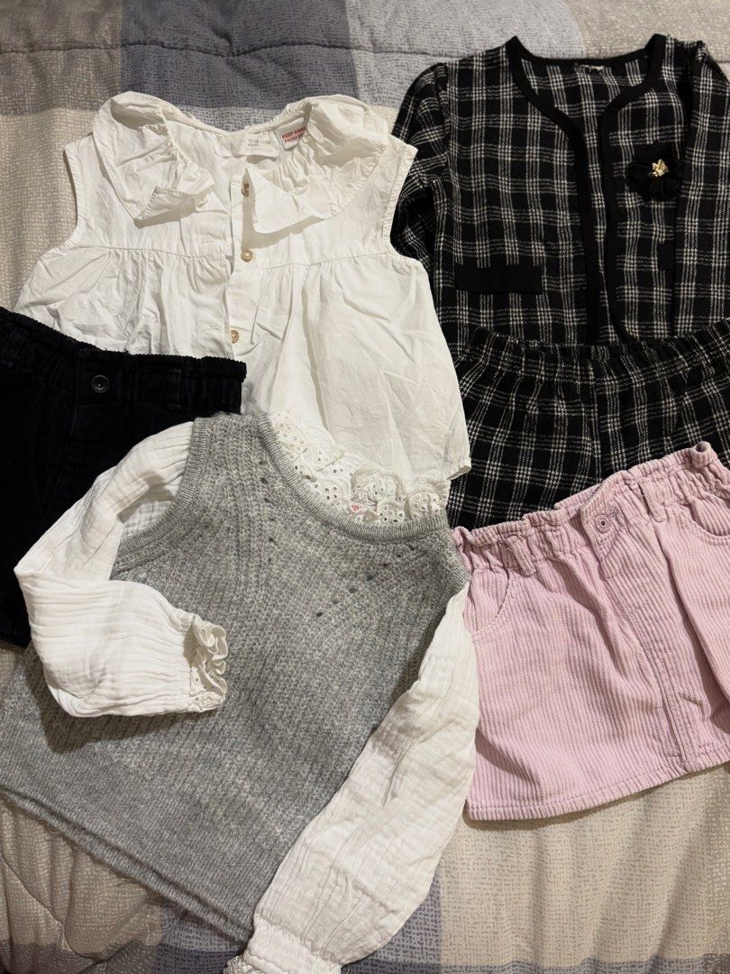 TAKE ALL!! Zara and raising litte (Category: Babies & Kids Fashion) located in Bacoor. Submitted by ynnnaaa (Listing ID 1461210030, Image 1). Description: - Bundle of girls' clothes - Includes: white tops with ruffled collars, grey knit vest, black & white plaid jacket and shorts set, black corduroy skirt, pink corduroy skirt - Perfect for mix-and-match outfits - Features cute button details and lace trim.