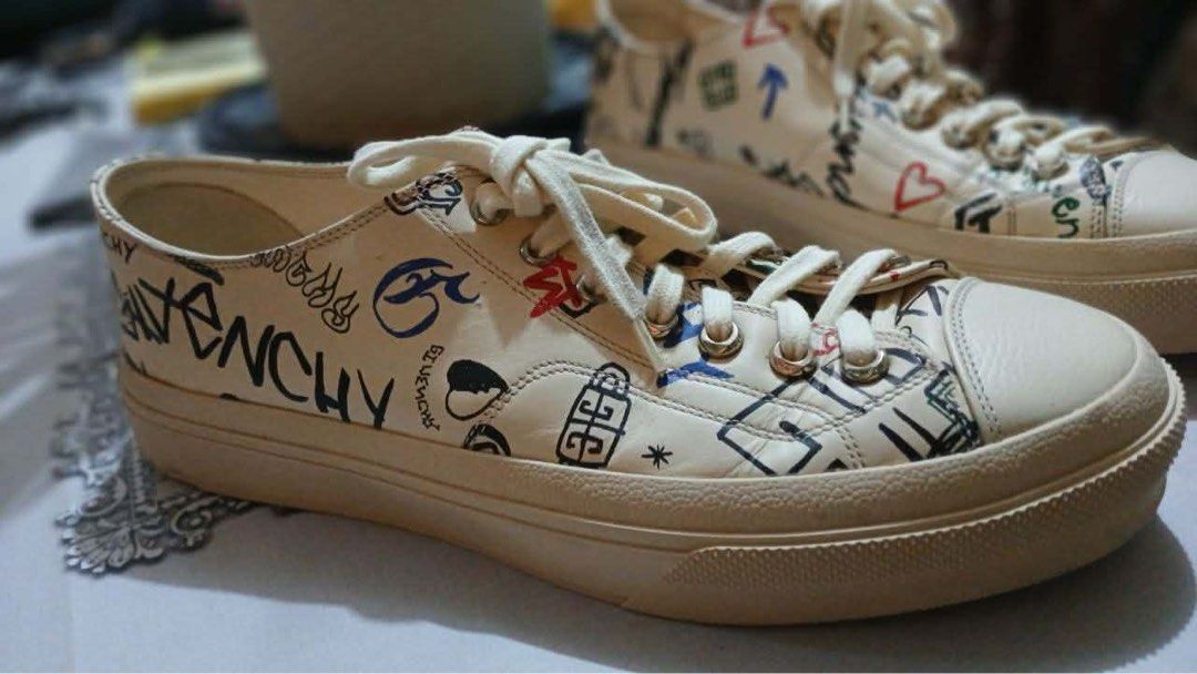 Givenchy (Category: Casual Shoes) located in Manila. Submitted by trueocean-0cd1 (Listing ID 1461229400, Image 3). Description: Brand: Givenchy Model: City Low Sneaker Color: Multicolored/ Cream Style: All over graffiti print Style cod: BH006DH19F-960 No Box!! Slightly worn RS: grew tired of it and not my father’s style .