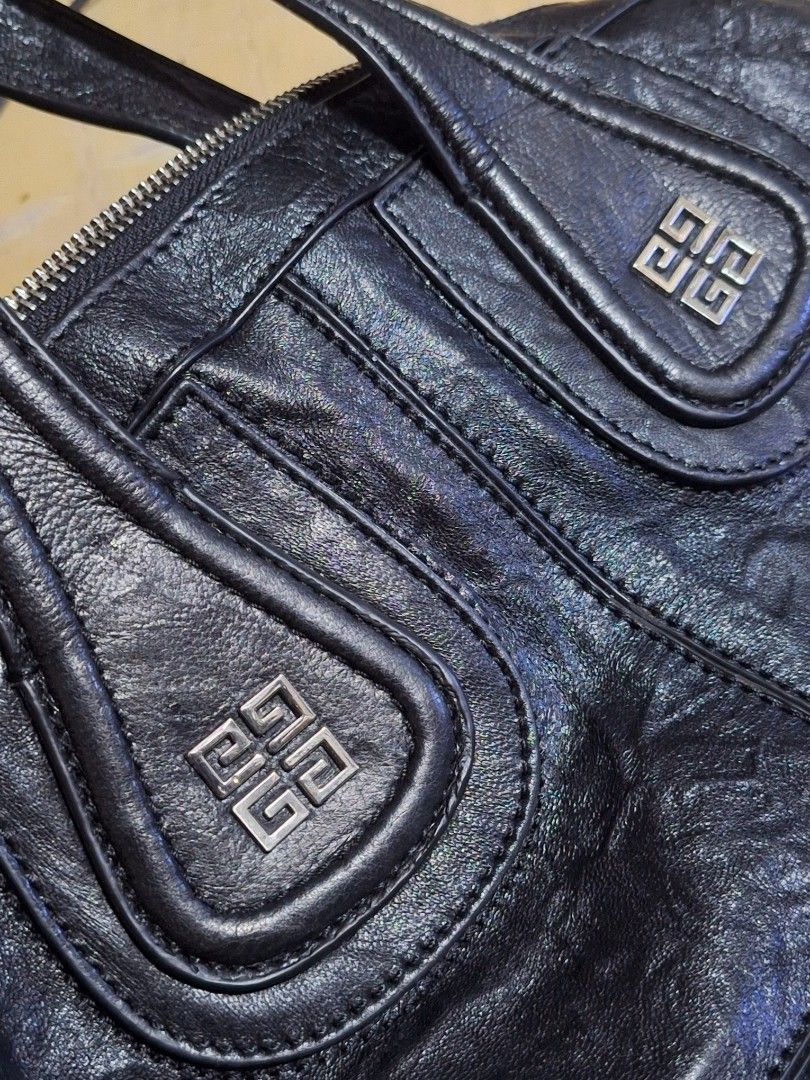 Givenchy Nightingale Black Leather Handbag (Category: Luxury Bags & Wallets) located in Quezon City. Submitted by cloudymay (Listing ID 1461276883, Image 2). Description: - Givenchy black leather handbag - Made in Italy - Iconic Givenchy logo hardware - Zipper closure - Soft, slouchy structure, ideal for everyday use - Missing strap - 9/10 leather and hardware condition - Very pretty.