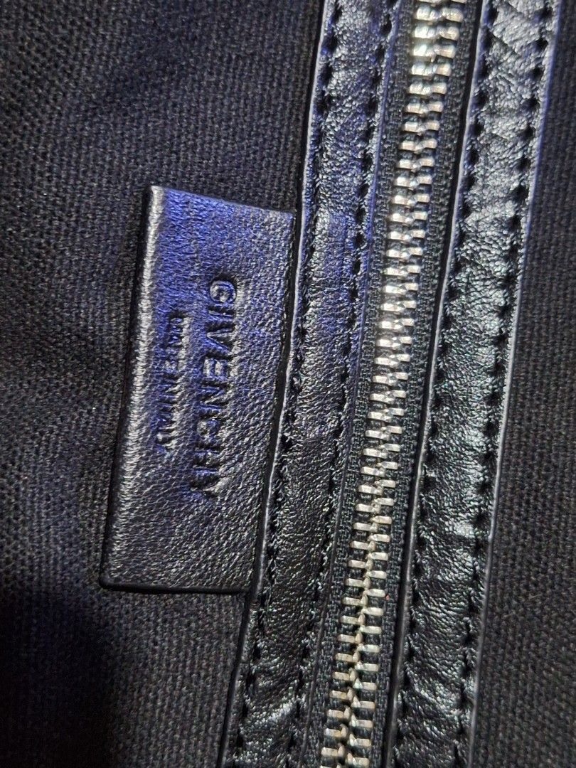 Givenchy Nightingale Black Leather Handbag (Category: Luxury Bags & Wallets) located in Quezon City. Submitted by cloudymay (Listing ID 1461276883, Image 3). Description: - Givenchy black leather handbag - Made in Italy - Iconic Givenchy logo hardware - Zipper closure - Soft, slouchy structure, ideal for everyday use - Missing strap - 9/10 leather and hardware condition - Very pretty.