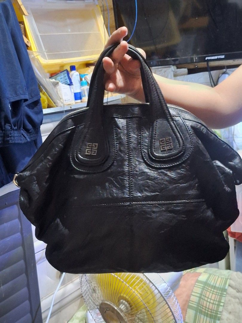Givenchy Nightingale Black Leather Handbag (Category: Luxury Bags & Wallets) located in Quezon City. Submitted by cloudymay (Listing ID 1461276883, Image 1). Description: - Givenchy black leather handbag - Made in Italy - Iconic Givenchy logo hardware - Zipper closure - Soft, slouchy structure, ideal for everyday use - Missing strap - 9/10 leather and hardware condition - Very pretty.