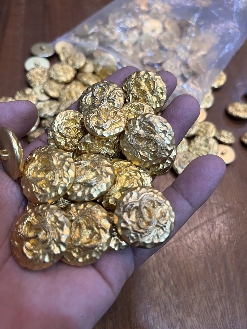 Gold Tone Designer Buttons for Crafts or Sewing (Category: Craft Supplies & Tools) located in Dasmarinas. Submitted by emmakim08 (Listing ID 1461293696, Image 1). Description: Vintage buttons Chanel design Big 138pcs Small 49pcs Take all 500pesos only.