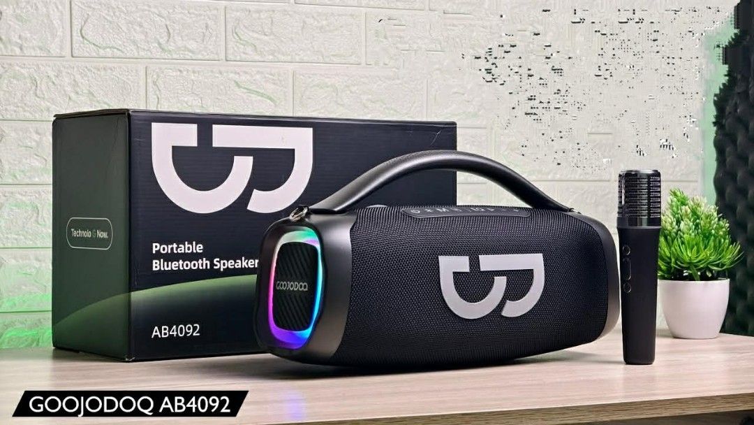 GOOJODOQ AB4092 Portable Bluetooth Speaker with Microphone (Category: Soundbars, Speakers & Amplifiers) located in Santa Rosa. Submitted by keendeer.6c83cc (Listing ID 1461178189, Image 1). Description: - Portable Bluetooth speaker with handle - Includes microphone for karaoke - Features colorful LED lights on the front - Wireless connectivity for easy setup - Ideal for parties and gatherings - Easy to carry around - Original box included.