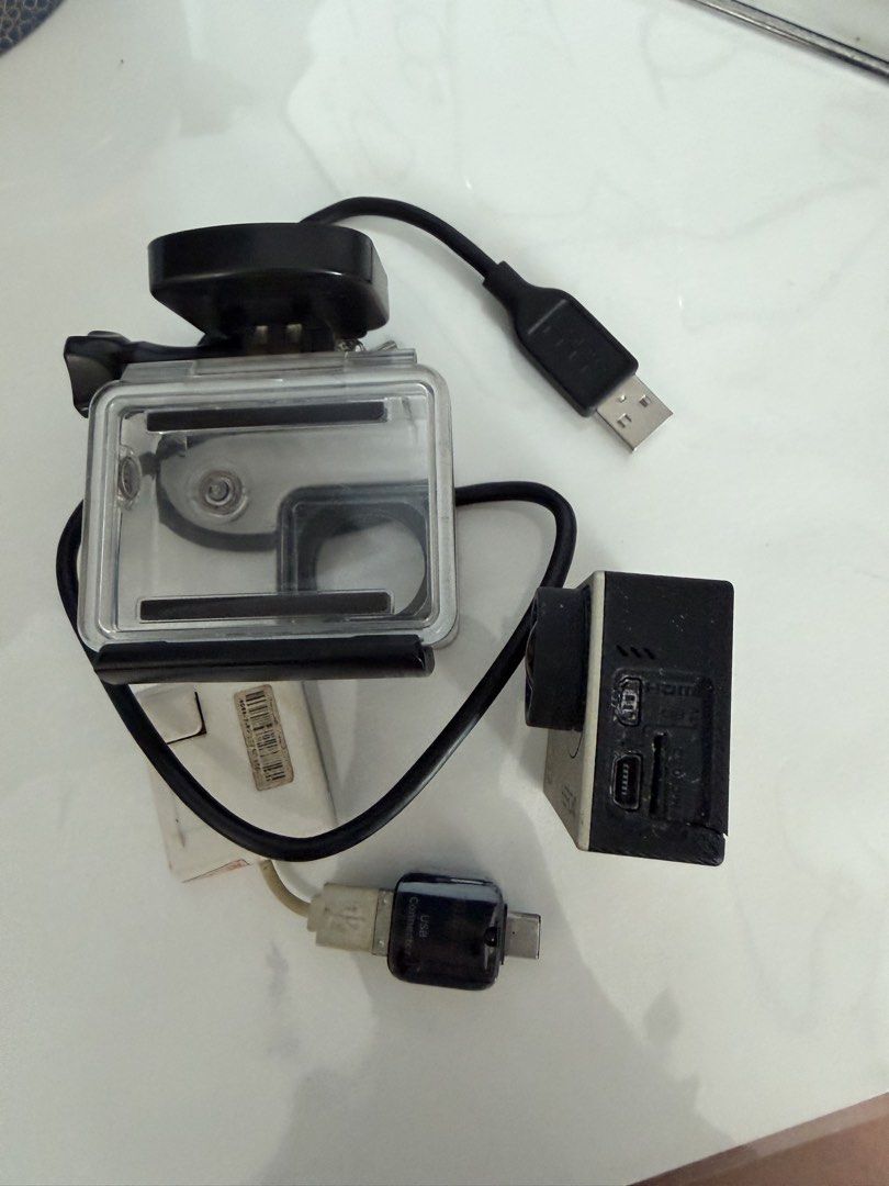 GoPro HERO4 Silver Action Camera with Waterproof Case & Accessories (Category: Cameras) located in Manila. Submitted by kristielyntan (Listing ID 1461129314, Image 3). Description: - GoPro HERO4 Silver camera - Waterproof housing case included - USB charging cable - Small adapter - Ideal for capturing adventures - Ready for your next trip.