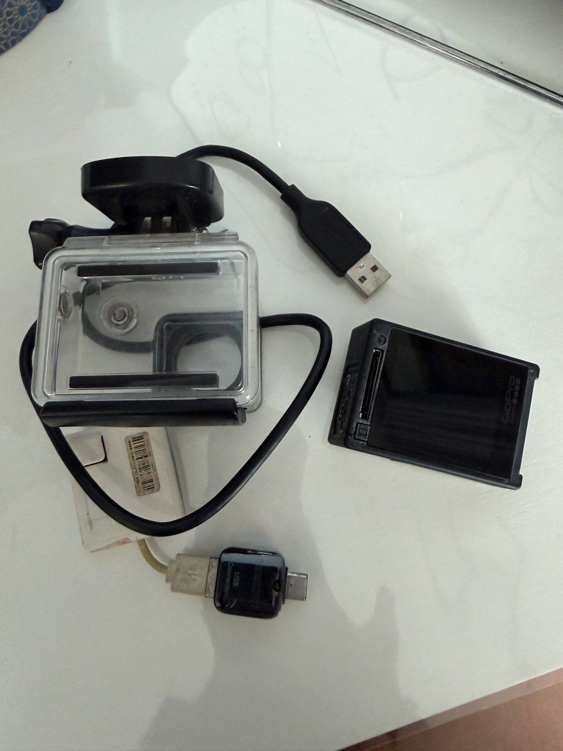 GoPro HERO4 Silver Action Camera with Waterproof Case & Accessories (Category: Cameras) located in Manila. Submitted by kristielyntan (Listing ID 1461129314, Image 2). Description: - GoPro HERO4 Silver camera - Waterproof housing case included - USB charging cable - Small adapter - Ideal for capturing adventures - Ready for your next trip.