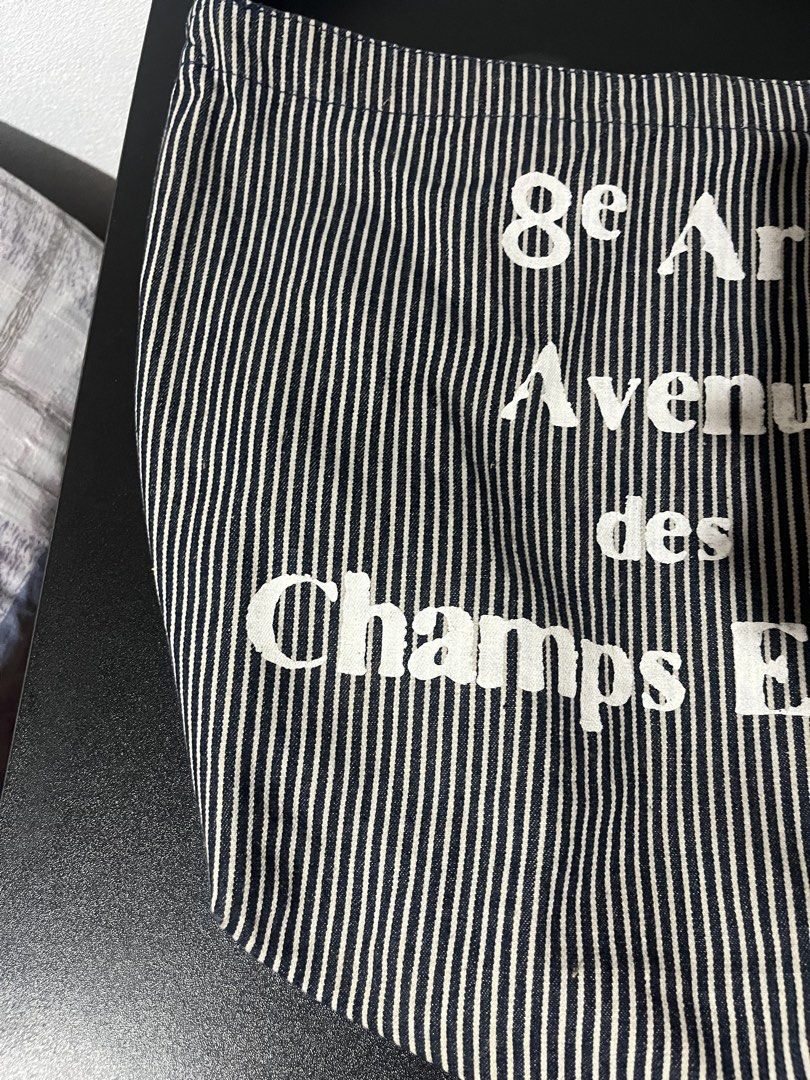 Graphic Striped tote bag y2k office (Category: Shoulder Bags) located in Tuguegarao City. Submitted by wear.lyunji (Listing ID 1461124683, Image 2). Description: spacious snap button has one compartment.