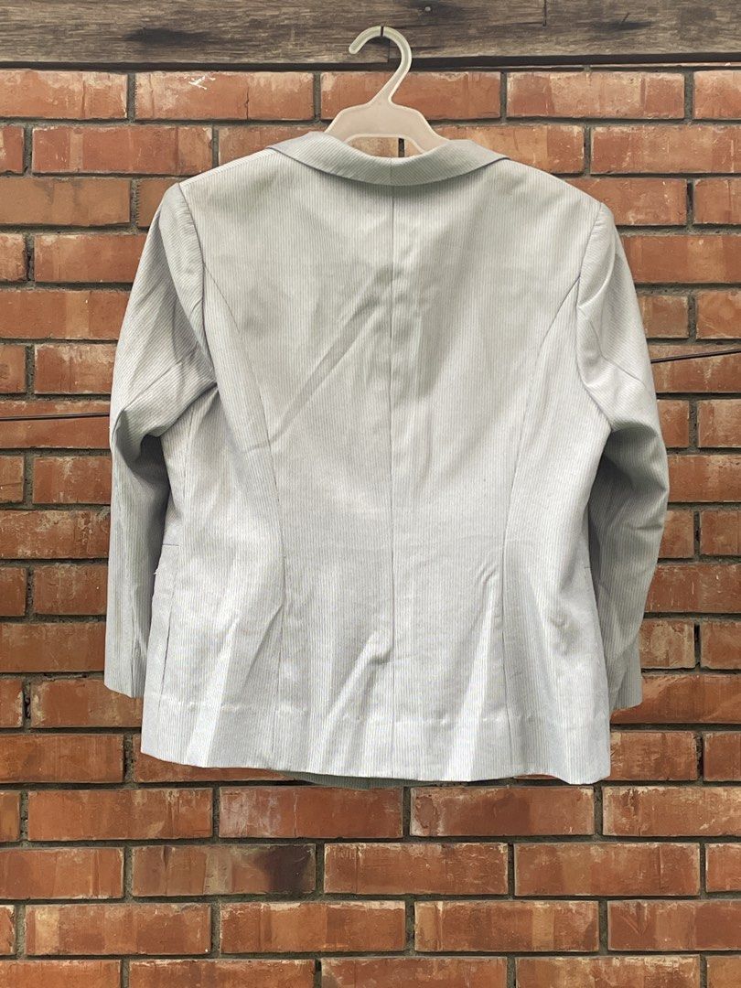 Gray pinstripe blazer (Category: Others Tops) located in Quezon City. Submitted by liama (Listing ID 1461122444, Image 2). Description: Tailoring gives nice silhouette Can go casual to dressy with light or dark top/ pants / skirt Lightweight, easy to maintain < 2-day reservation period; GCash; buyer books/pays for pick up : QC EDSA-GMA area, OR if u r in vicinity i cn jst hand it over to u>.