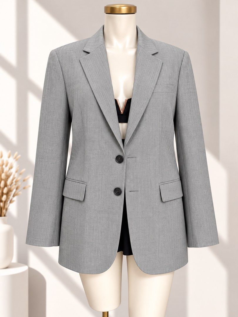 Gray Pinstriped Oversized Blazer (Category: Coats, Jackets and Outerwear) located in Taguig. Submitted by vm.co (Listing ID 1461313923, Image 1). Description: Perfect for: • Corporate office wear • Business travel • Smart casual outfits • Rainy or cool weather • Capsule wardrobe • Everyday sophisticated styling Condition: Appears to be in very good preloved condition with no visible major stains, tears, or discoloration in the photo. A light stea