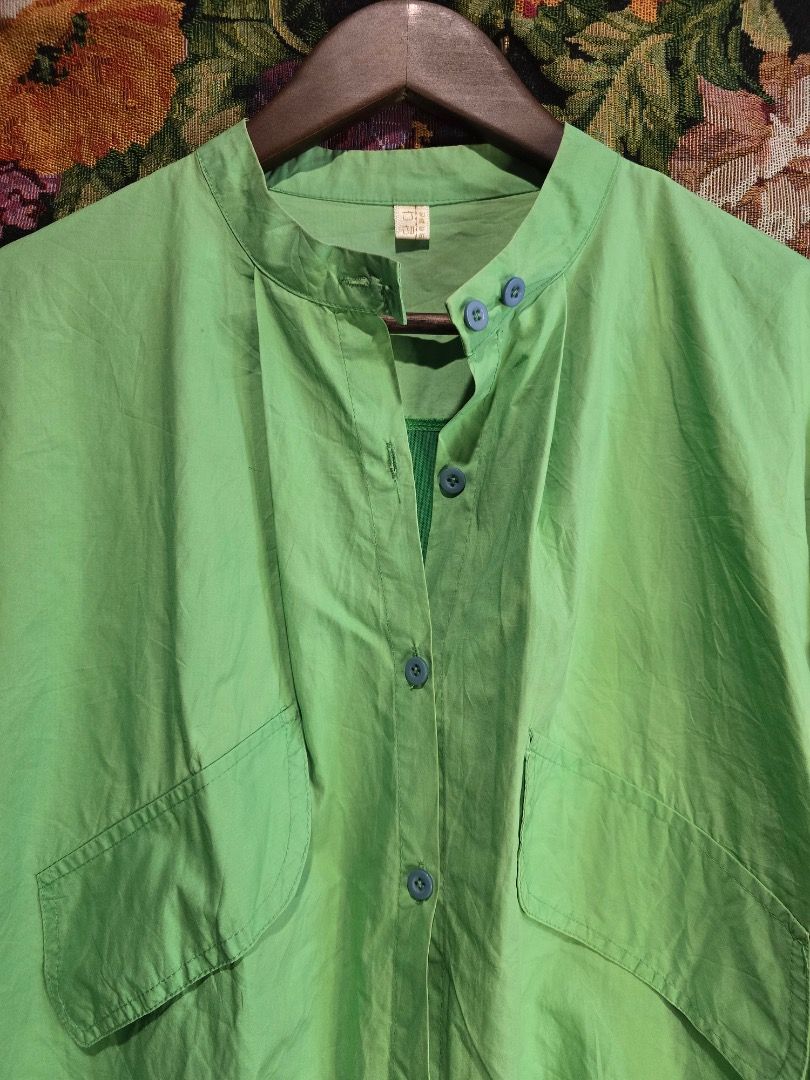 Green Button-Up Shirt with Mesh Panel (Category: Shirts) located in Paranaque City. Submitted by titaartestudio (Listing ID 1461269992, Image 2). Description: - Light green button-up shirt - Mandarin collar - Two chest pockets - Green mesh panel across the back - Green mesh panel on the sleeves - Water-resistant.