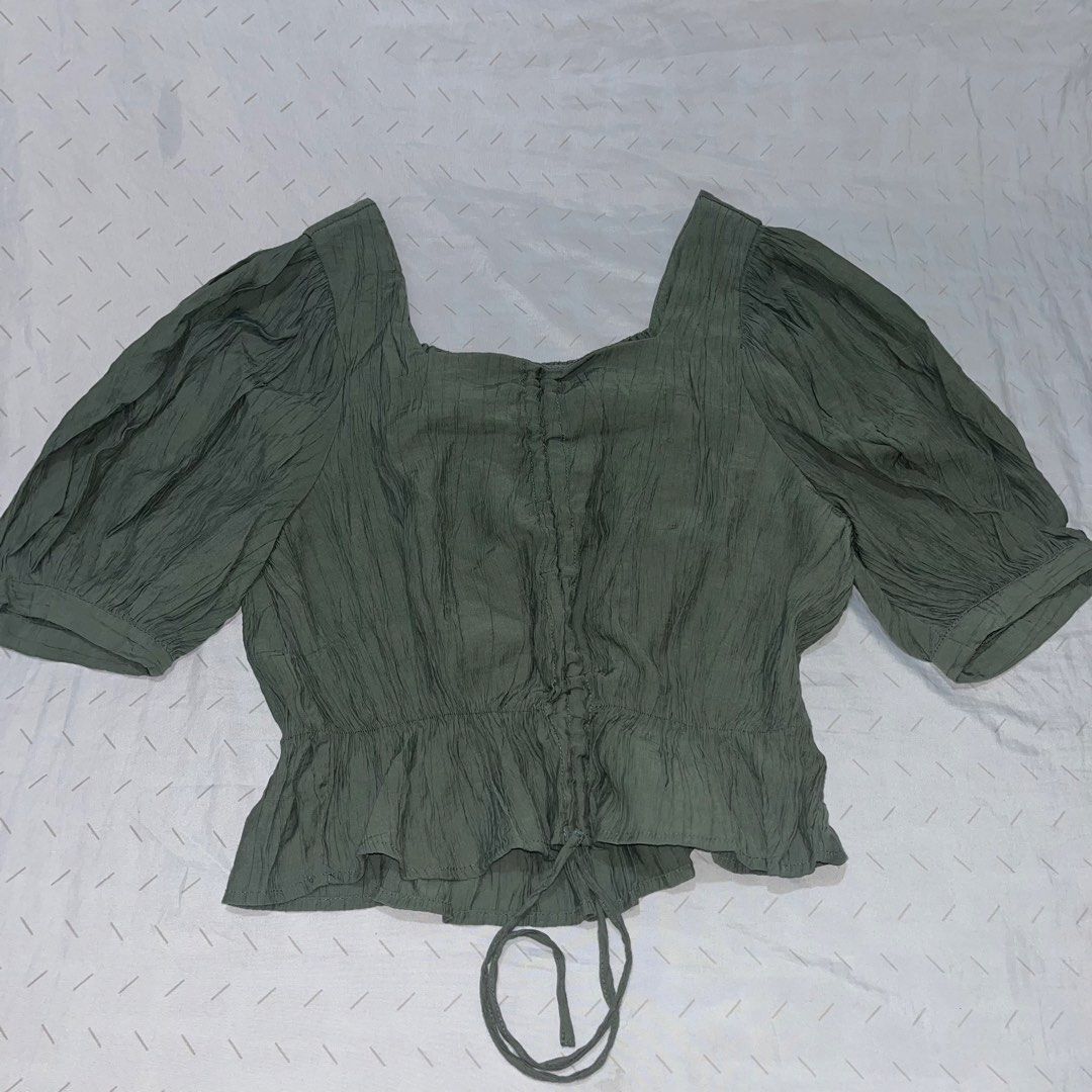 ST29 Green Square Neck Puff Sleeve Ruched Top (Category: Blouses) located in Marikina City. Submitted by namicorner (Listing ID 1461267407, Image 1). Description: - Green top - Square neckline - Puff sleeves - Ruched front with drawstring tie - Cinched hem with drawstring -best fit S to M ~~ > RFS - decluttering > Last price posted > NO RETURN/ NO EXCHANGE > Manage expectation as this is a preloved item..