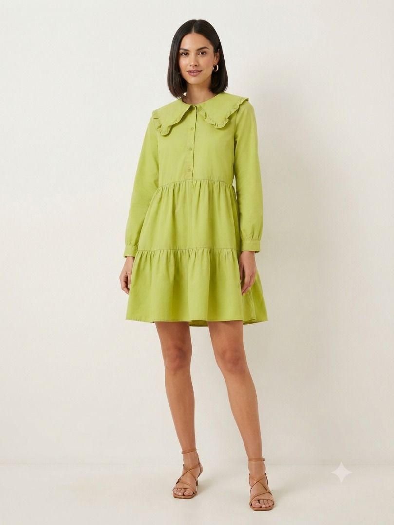 Green Tiered Mini Dress with Peter Pan Collar (Category: Dresses) located in Caloocan City. Submitted by truehawk_30384f (Listing ID 1461282296, Image 2). Description: - Adorable green tiered mini dress - Features a large Peter Pan collar with ruffled edges - Long sleeves - Button-up front - Two-tiered skirt - Versatile for casual outings or fun events.