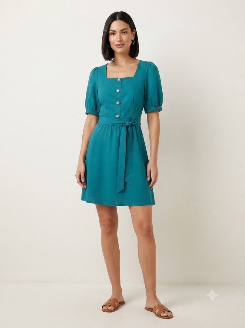 Green Tiered Mini Dress with Peter Pan Collar (Category: Dresses) located in Caloocan City. Submitted by truehawk_30384f (Listing ID 1461282296, Image 1). Description: - Adorable green tiered mini dress - Features a large Peter Pan collar with ruffled edges - Long sleeves - Button-up front - Two-tiered skirt - Versatile for casual outings or fun events.