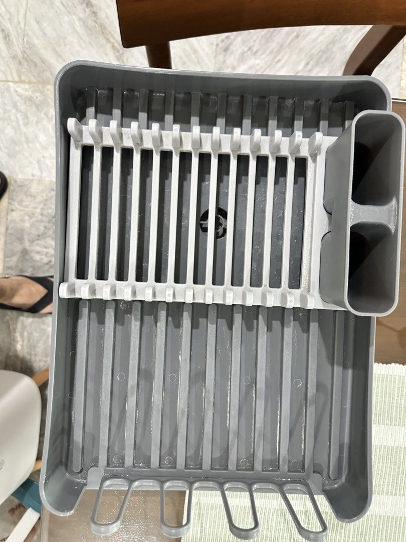 Grey Dish Rack for Kitchen Countertop (Category: Other Kitchenware & Tableware) located in Caloocan City. Submitted by kianoto (Listing ID 1461148393, Image 1). Description: - Grey dish rack - Holds plates, cups, and cutlery - Ideal for drying dishes - Organizes kitchen counters - Compact size fits most spaces - Easy to clean.