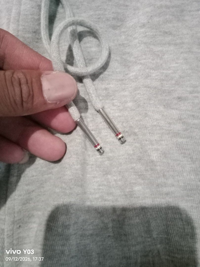 Grey Thom Browne Sweatpants with White Stripes (Category: Joggers) located in Cabuyao City. Submitted by blake657 (Listing ID 1461230974, Image 2). Description: - Grey sweatpants - Signature white stripes on the side - Elastic waistband with adjustable drawstring - Ribbed cuffs for a snug fit - Small white tag detail on lower leg - Comfortable and stylish for everyday wear.