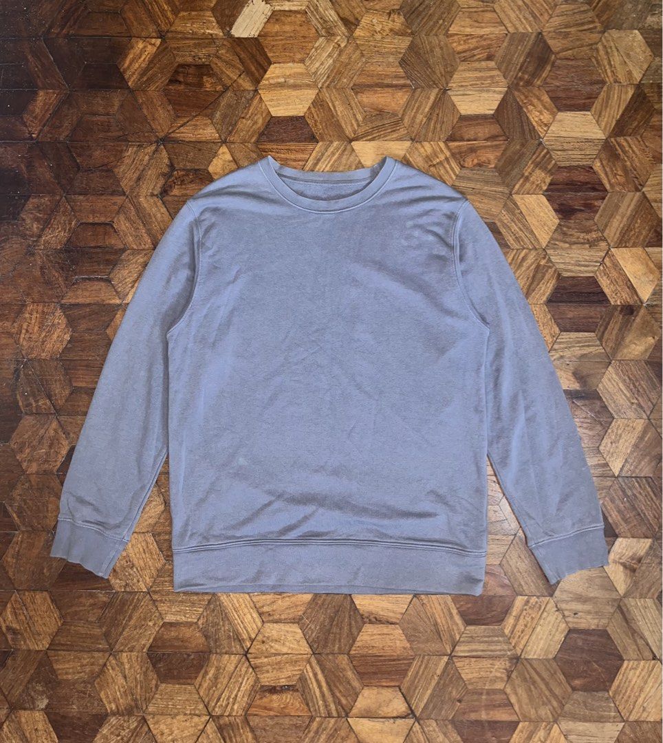GU Gray Crewneck Sweatshirt (Category: Coats, Jackets and Outerwear) located in Manila. Submitted by themythfs (Listing ID 1461178916, Image 1). Description: Large on tag Length - 29” Width - 21” Sleeve length - 25” Issue: Minor stains.