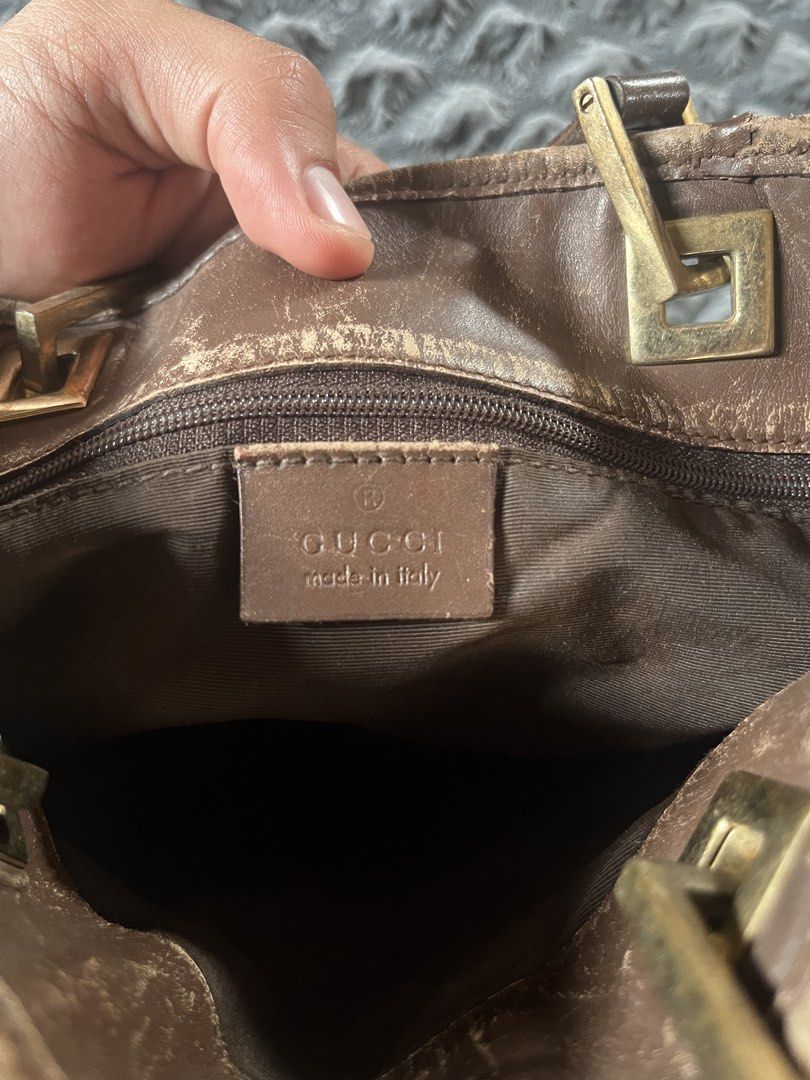 Gucci GG Monogram Canvas Tote Bag (Category: Luxury Bags & Wallets) located in Calamba. Submitted by vtg_ukay_bags (Listing ID 1461190067, Image 3). Description: - Authentic brown Gucci tote bag - Classic GG monogram pattern - Genuine leather straps and trim - Interior zipper pocket - Minor signs of wear on leather base and straps - Made in Italy - Serial number: 001.1009 001998.