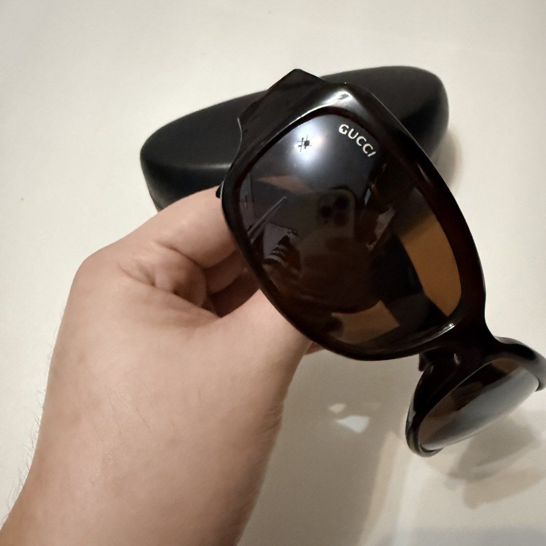 Gucci Sunglasses (Category: Sunglasses & Eyewear) located in Angeles City. Submitted by a.k.onlineshopp (Listing ID 1461227096, Image 2). Description: * Authentic Gucci sunglasses * Dark brown frames * Large Gucci logo on the arms * Comes with a non-original hard case * Perfect for sunny days.