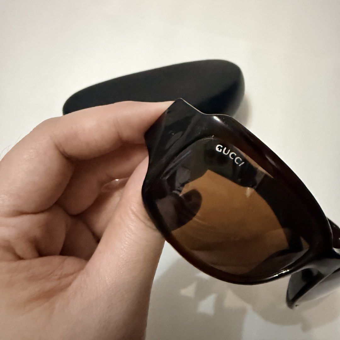 Gucci Sunglasses (Category: Sunglasses & Eyewear) located in Angeles City. Submitted by a.k.onlineshopp (Listing ID 1461227096, Image 3). Description: * Authentic Gucci sunglasses * Dark brown frames * Large Gucci logo on the arms * Comes with a non-original hard case * Perfect for sunny days.