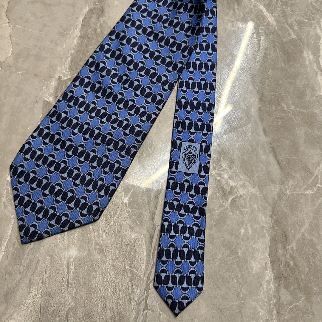 GUCCI Vintage Blue Patterned Silk Neck Tie (Category: Ties) located in Lemery. Submitted by thesecond_row.ph (Listing ID 1461211309, Image 3). Description: GUCCI Vintage Blue Patterned Silk Neck Tie Authentic! Made in Italy No issue Best for formal suits! 👔.