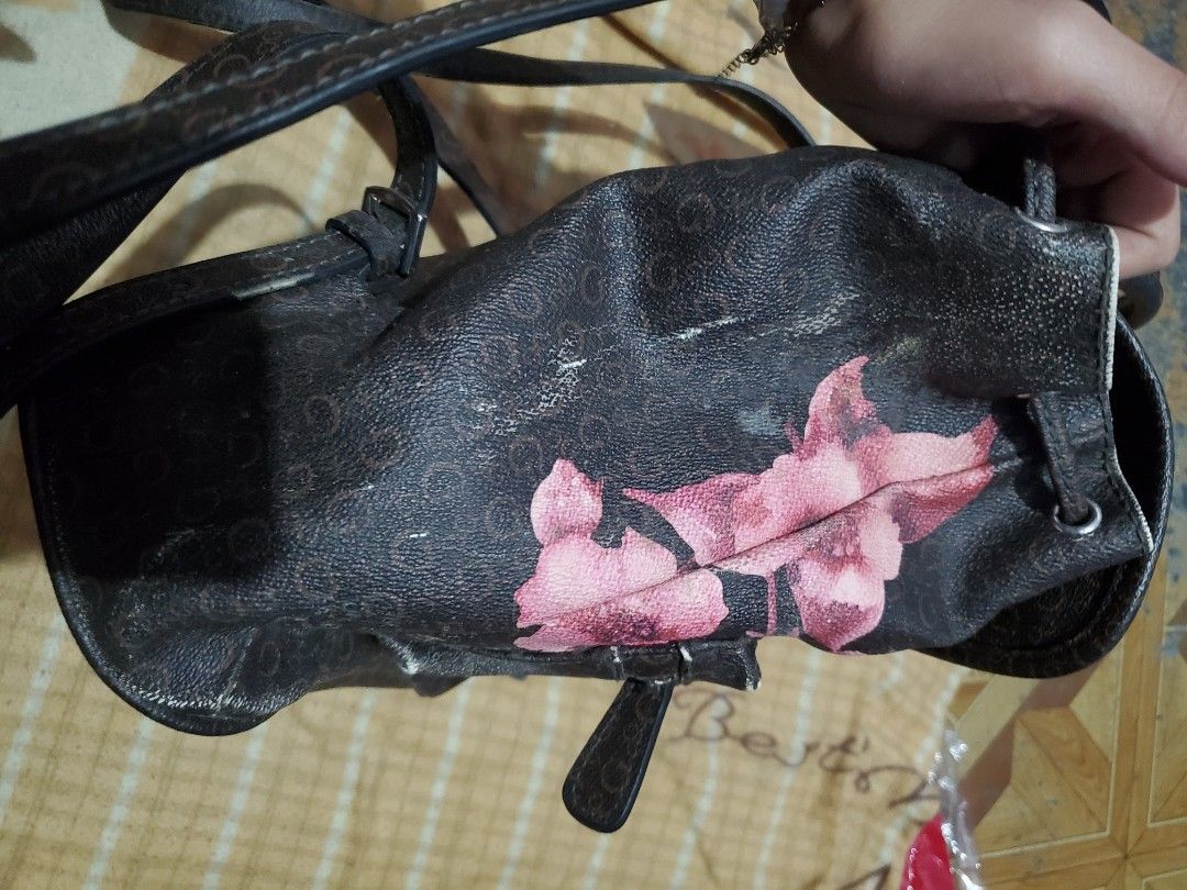 Guess Floral Monogram Backpack (Category: Backpacks) located in Manila. Submitted by dendenboomshakala (Listing ID 1461156569, Image 2). Description: - Guess backpack with signature monogram print - Features a prominent pink floral design on the front - Flap closure with buckle and a zip pocket - Adjustable straps for comfort - Ideal for everyday use or weekend trips.