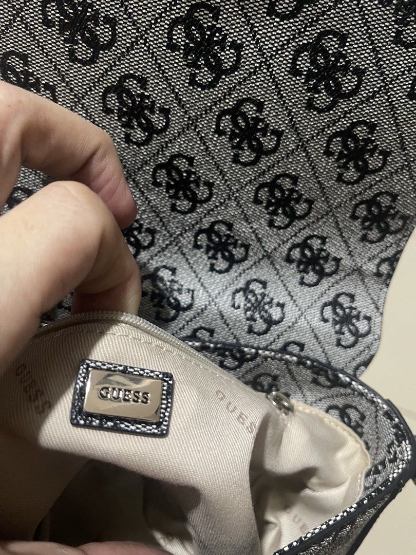 Guess Monogram Crossbody Bag (Category: Cross-body Bags) located in Manila. Submitted by brahma806 (Listing ID 1461204806, Image 2). Description: Classic Guess monogram crossbody bag in black and grey. Features a main compartment, internal zip pocket, and adjustable strap. Perfect for daily use..