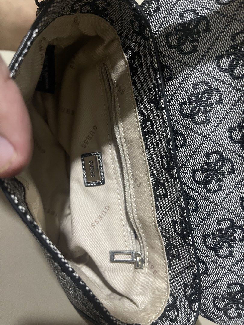 Guess Monogram Crossbody Bag (Category: Cross-body Bags) located in Manila. Submitted by brahma806 (Listing ID 1461204806, Image 3). Description: Classic Guess monogram crossbody bag in black and grey. Features a main compartment, internal zip pocket, and adjustable strap. Perfect for daily use..
