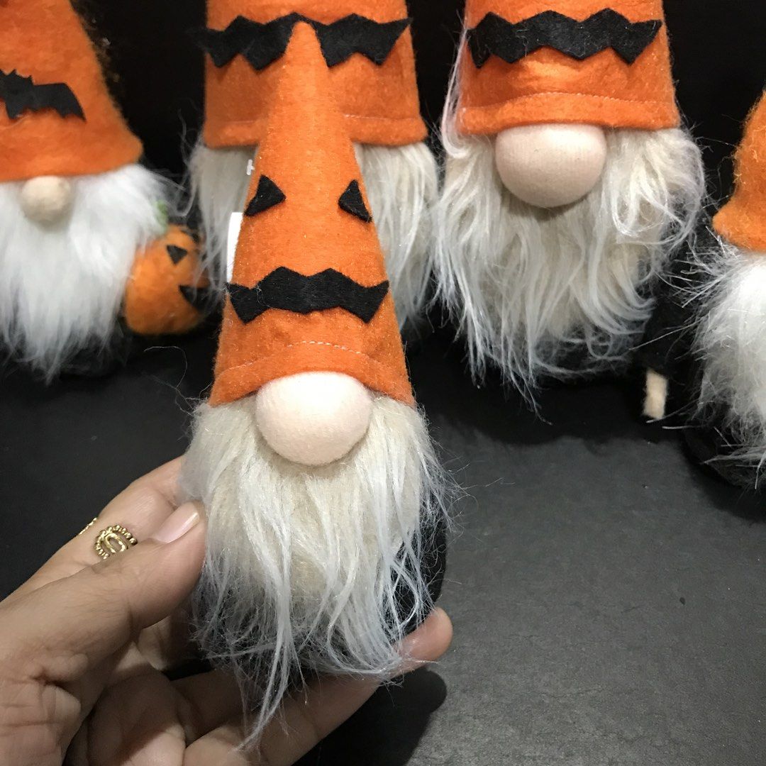 Halloween Gnomes Set - Orange Pumpkin Theme (Category: Plushies & Soft Toys) located in Baao. Submitted by all.things.japan (Listing ID 1461131466, Image 3). Description: - Set of 5 adorable Halloween gnomes - Orange hats with spooky jack-o'-lantern faces and bat accents - Features white beards and light tan noses - One gnome comes with a cute little pumpkin accessory - Ideal for adding a festive touch to your Halloween decor.