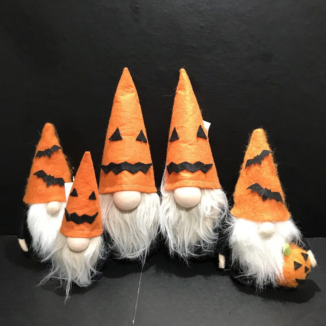 Halloween Gnomes Set - Orange Pumpkin Theme (Category: Plushies & Soft Toys) located in Baao. Submitted by all.things.japan (Listing ID 1461131466, Image 1). Description: - Set of 5 adorable Halloween gnomes - Orange hats with spooky jack-o'-lantern faces and bat accents - Features white beards and light tan noses - One gnome comes with a cute little pumpkin accessory - Ideal for adding a festive touch to your Halloween decor.